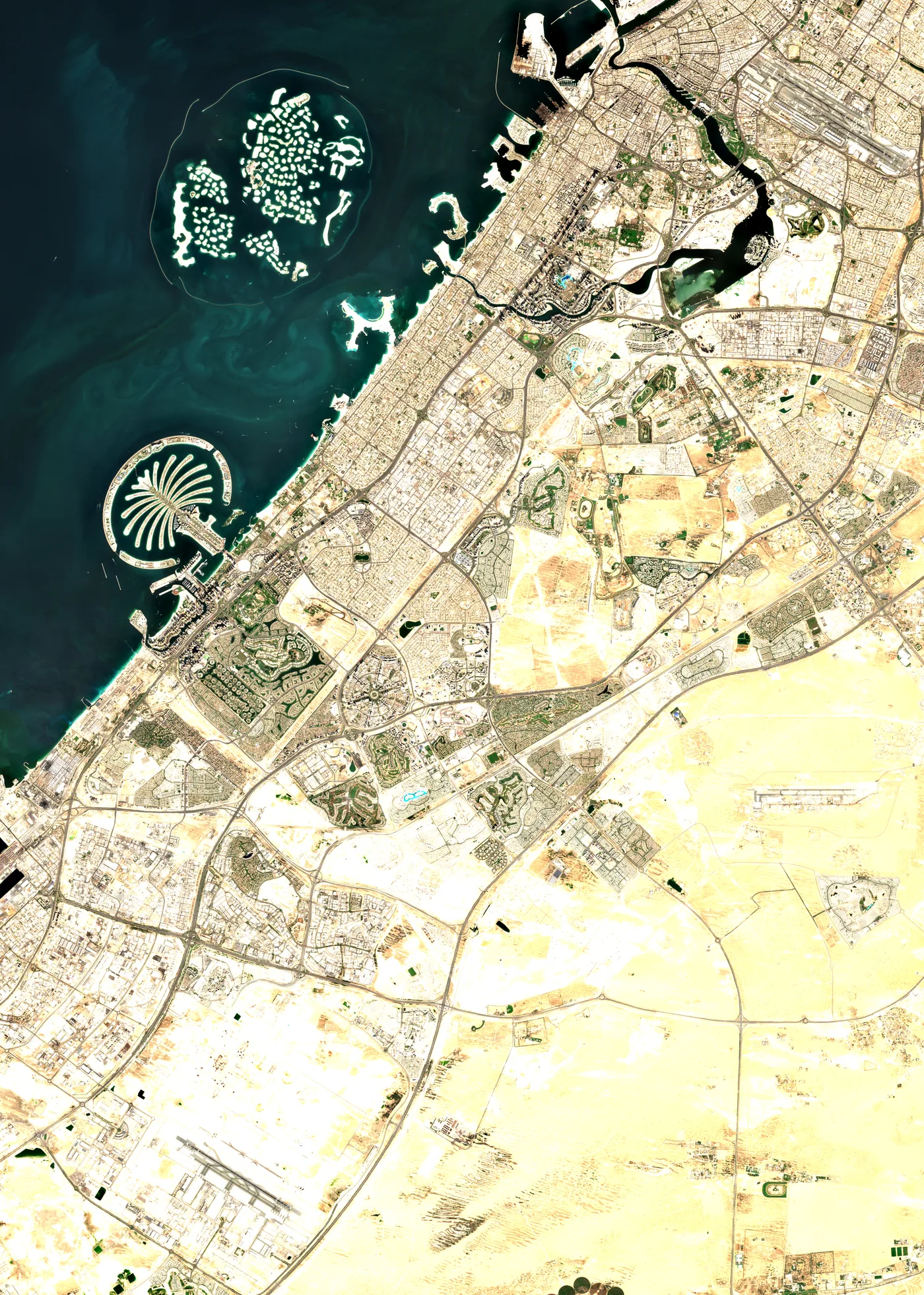 Satellite image of Dubai on 19 October 2026, from Palm Jumeirah and the World islands to Al Maktoum International, with Tilal Al Ghaf and its lagoon near the centre
